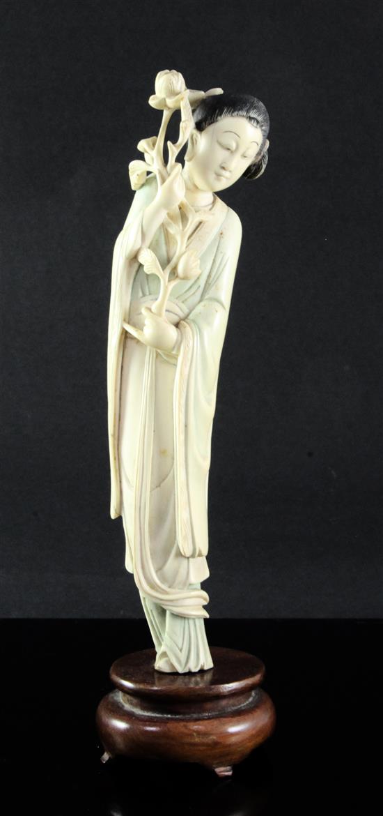 A Chinese ivory figure of a standing lady, early 20th century, 26.5cm